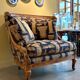 Armchair in a wooden confessional style with black and beige cotton.