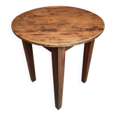Antique round side table with oak legs and a pine top, circa 1900.