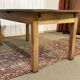 Extendable oak table from the 1930s with Gothic decoration.