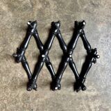 Napoleon III hinged wall-mounted coat rack in black wood