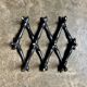 Napoleon III hinged wall-mounted coat rack in black wood