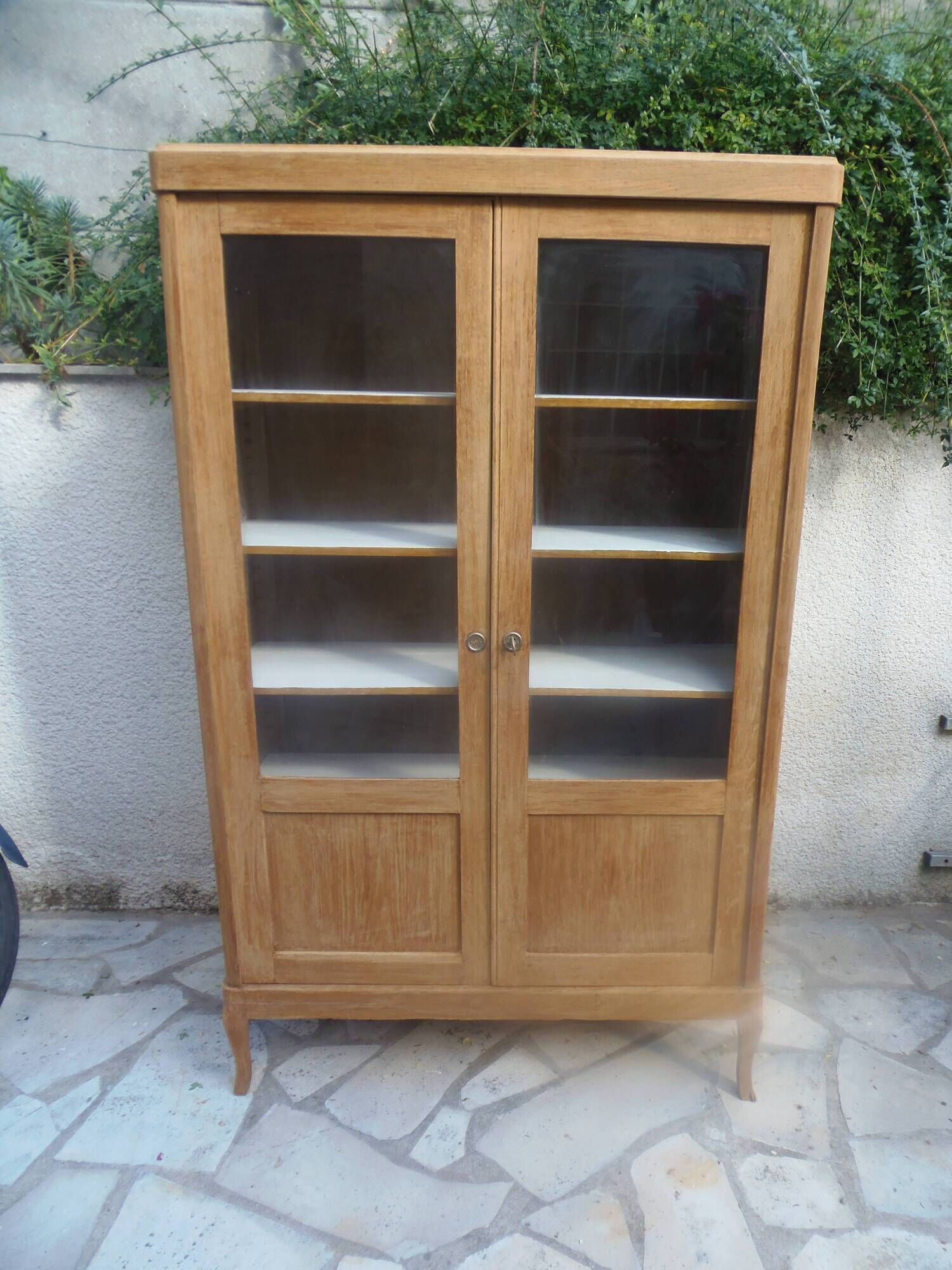 Charming vintage display cabinet from the 1950s in natural wood.
