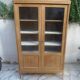 Charming vintage display cabinet from the 1950s in natural wood.