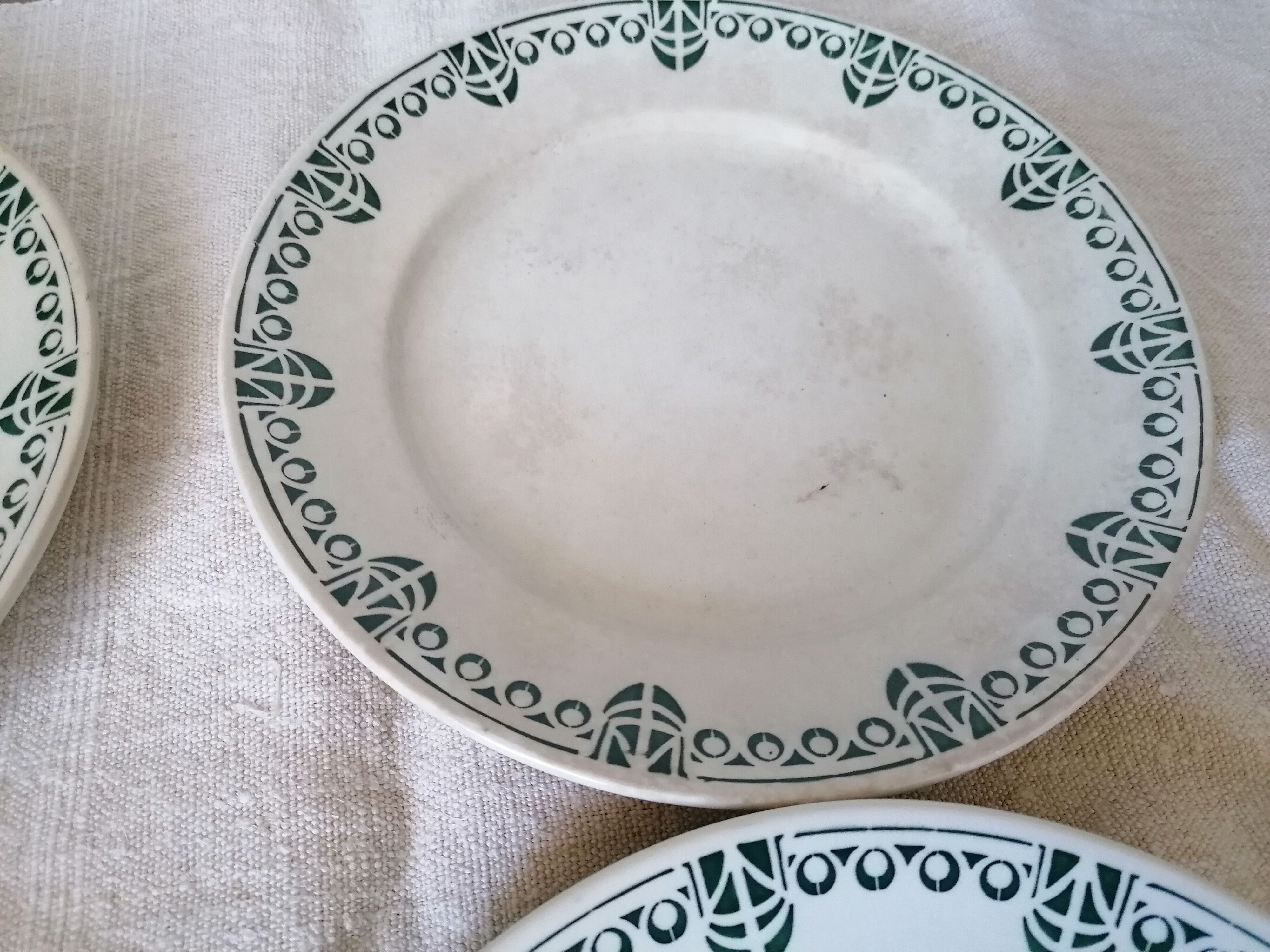 Set of 11 flat earthenware plates
