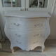 Curved patinated chest of drawers pearl grey waxed finish