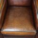 A very beautiful set of 2 Art Deco design armchairs in sheep leather