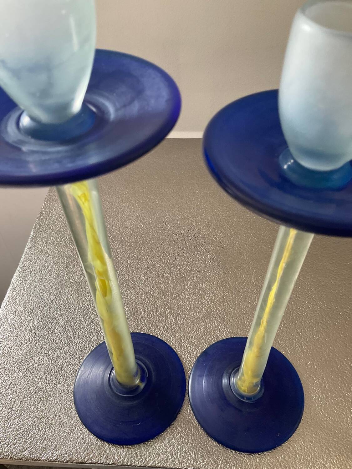 Duo of vintage Kosta Boda candlesticks in glass paste