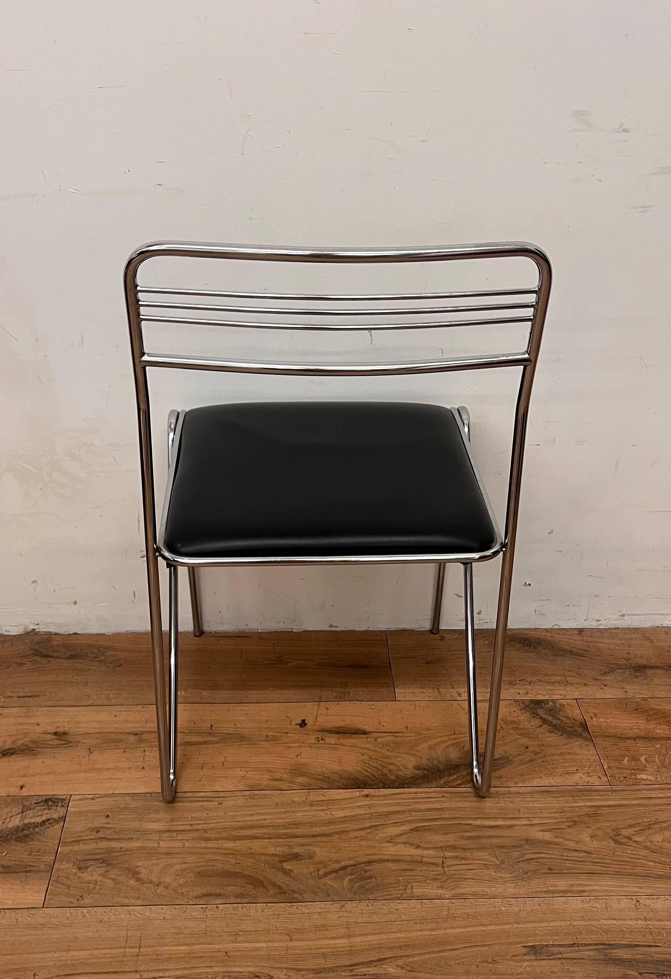 Three chrome and skai chairs from the 70s