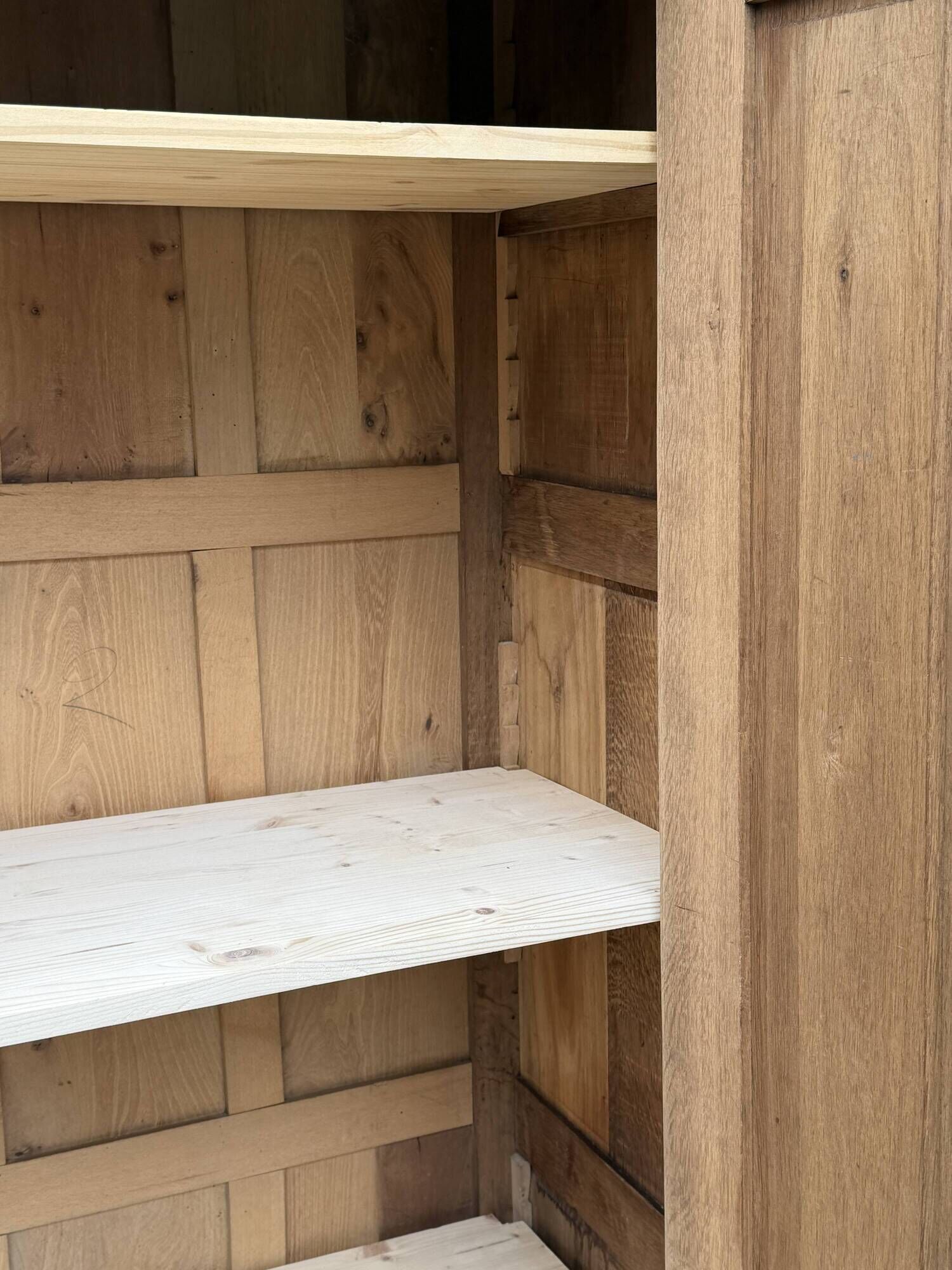Art Deco bonnetière wardrobe from Paris in raw and solid oak.
