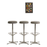 Trio of bar stools with restored seating and chrome-plated steel legs