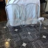 2 transparent plexiglass chairs