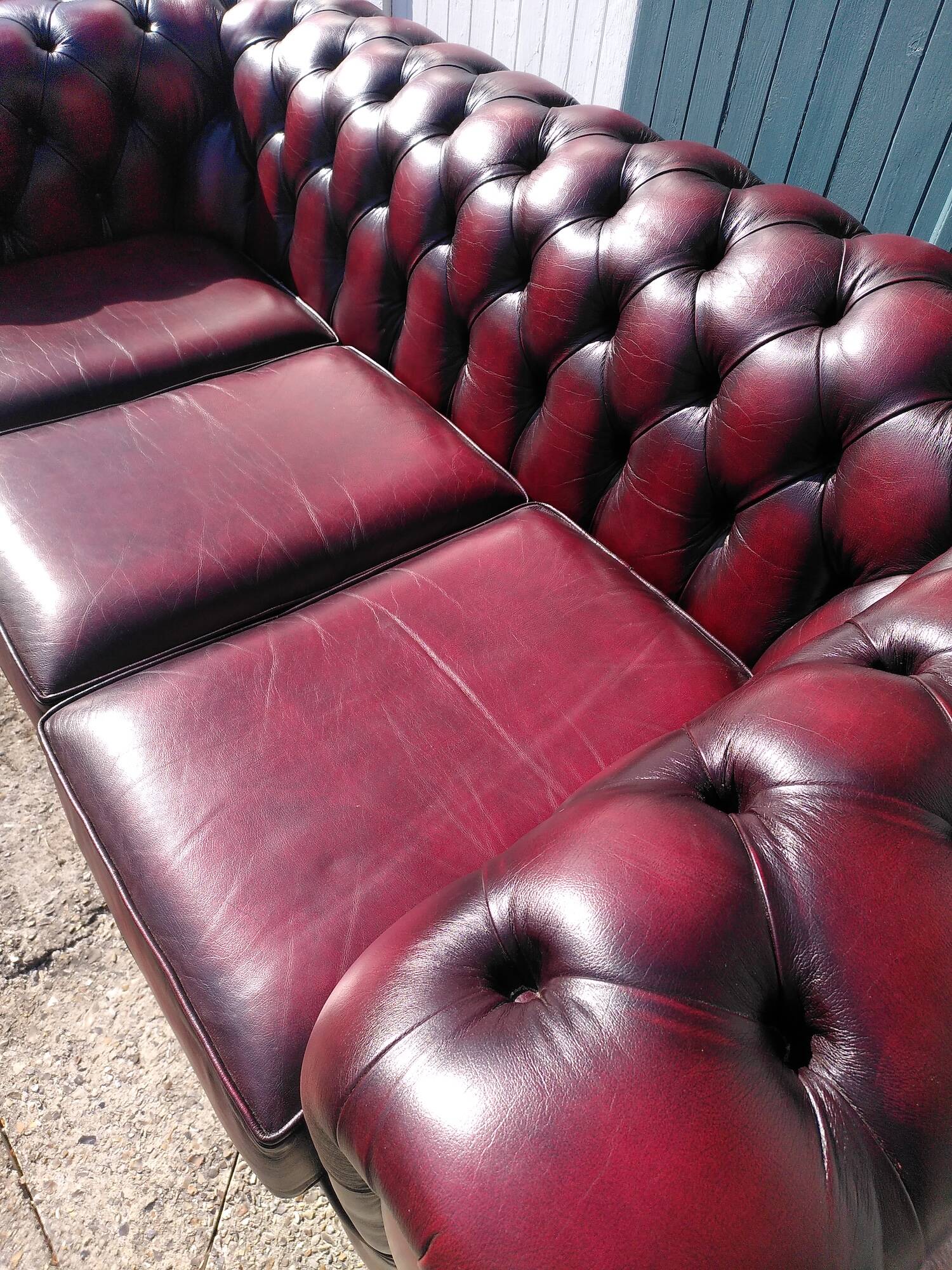 Burgundy Chesterfield-style sofa