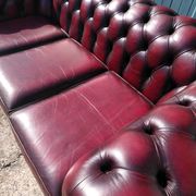 Burgundy Chesterfield-style sofa
