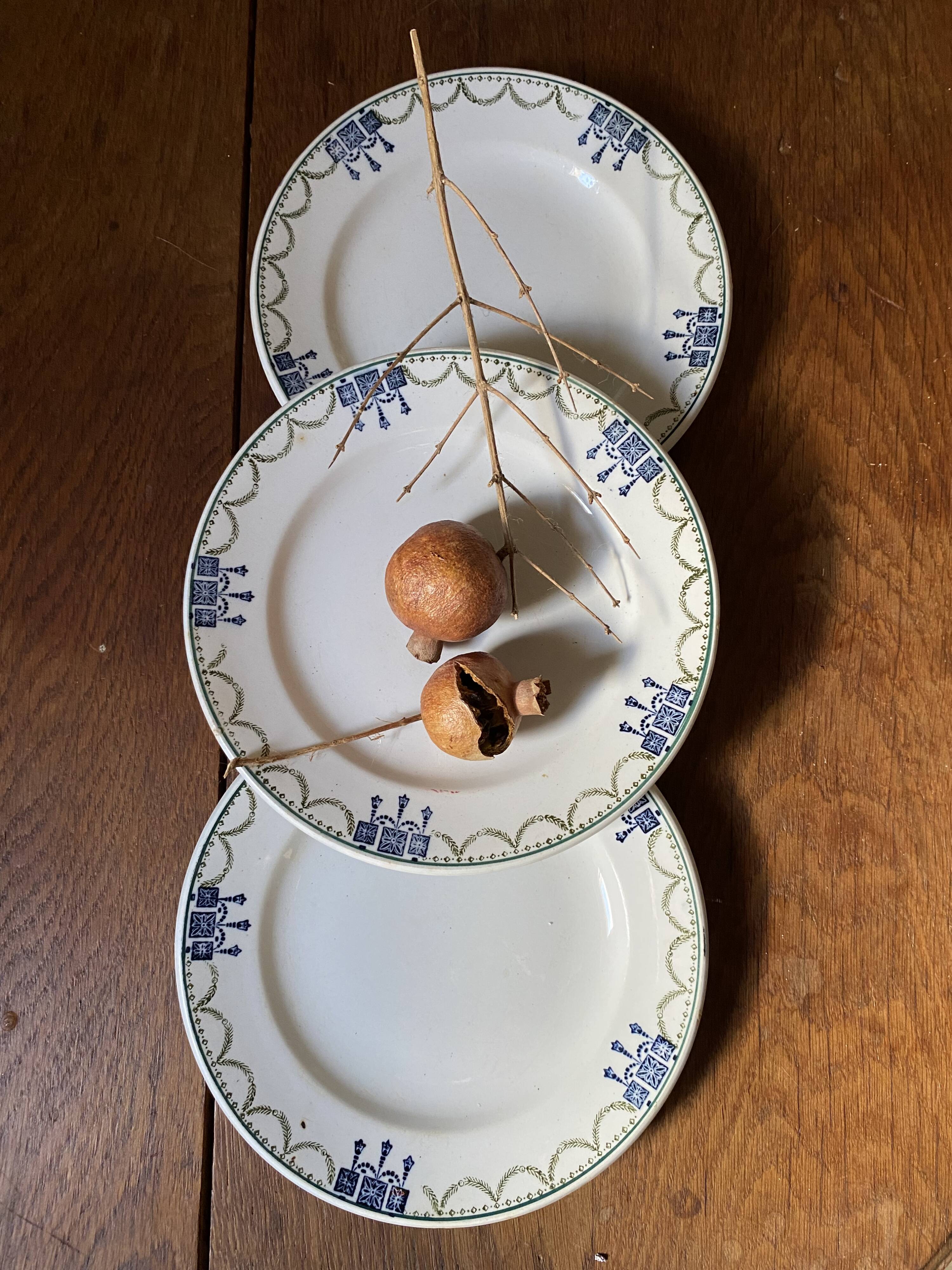 3 dessert plates stamped in art deco style.