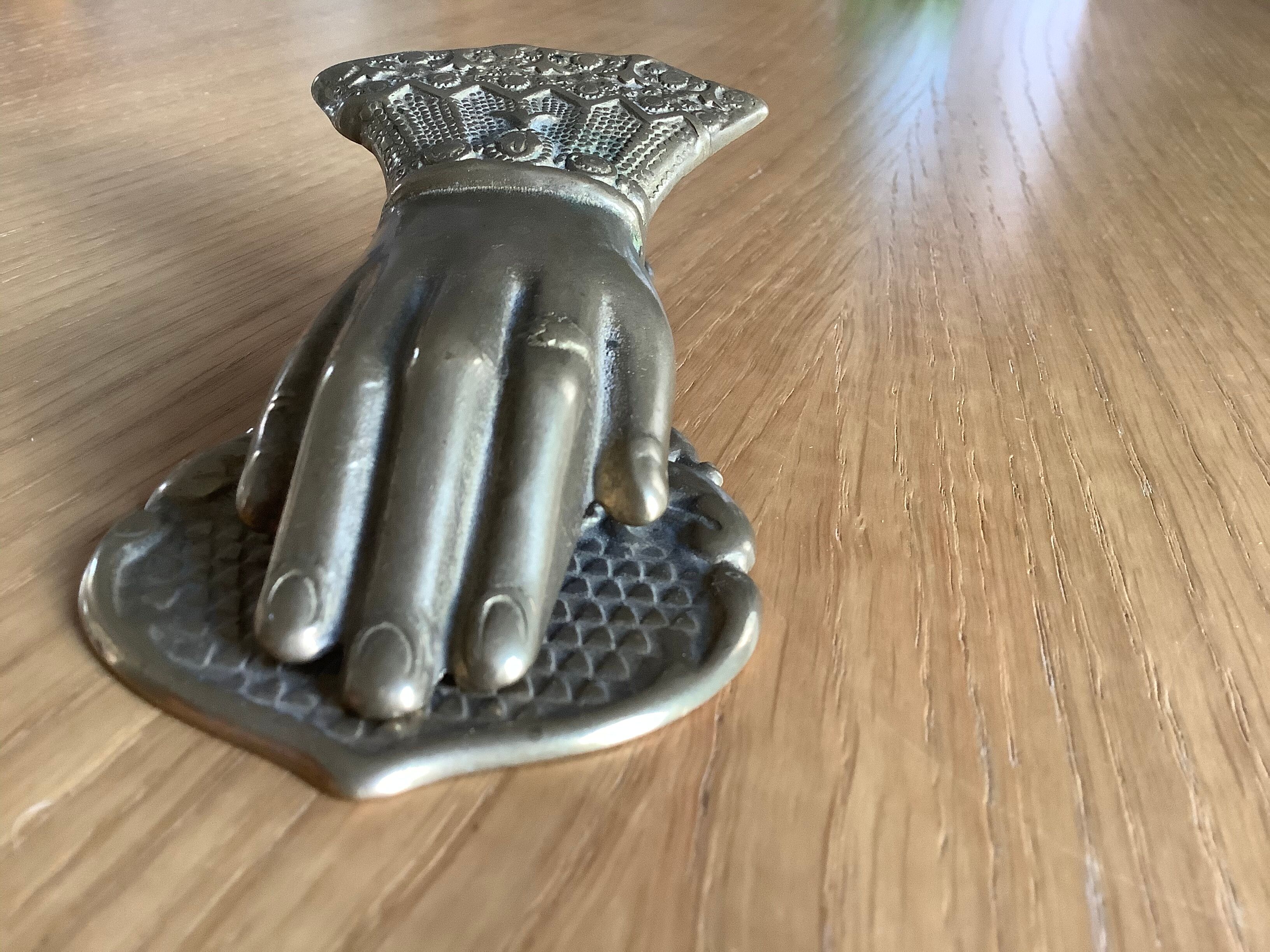 Brass paper press hand shape