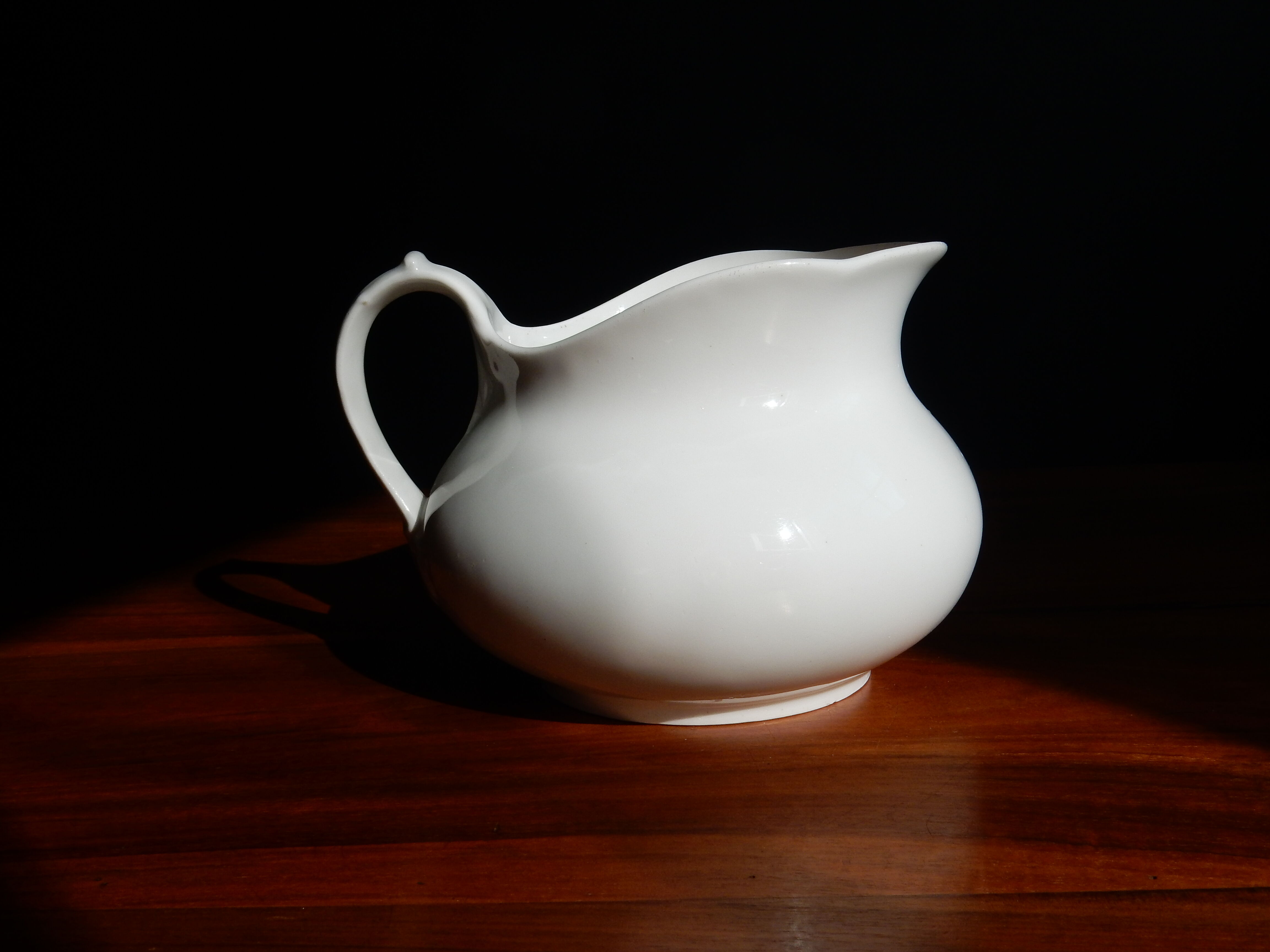 White ceramic water pitcher broc pot