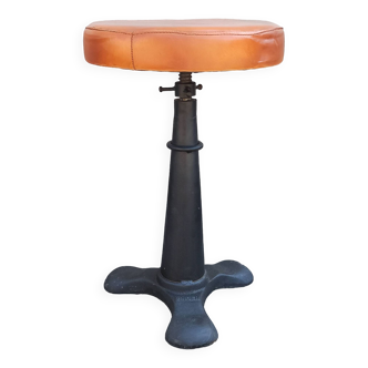 Height-adjustable leather stool with cast iron base