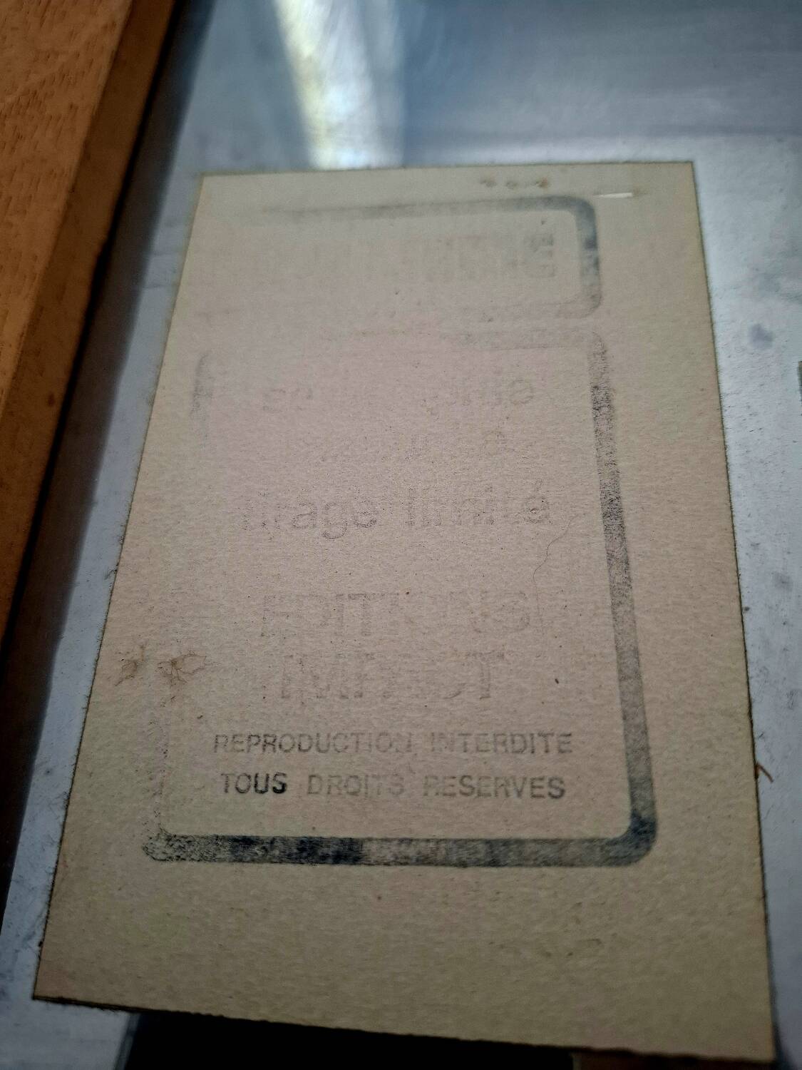 Silkscreen on brushed aluminium from the 1970s.