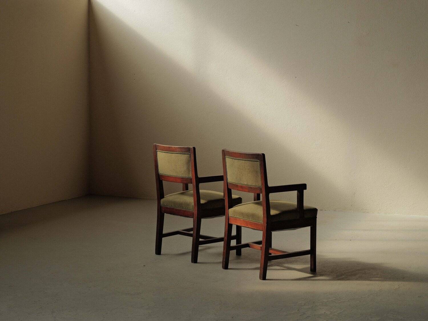 Pair of modernist armchairs in solid oak, France, circa 1940.