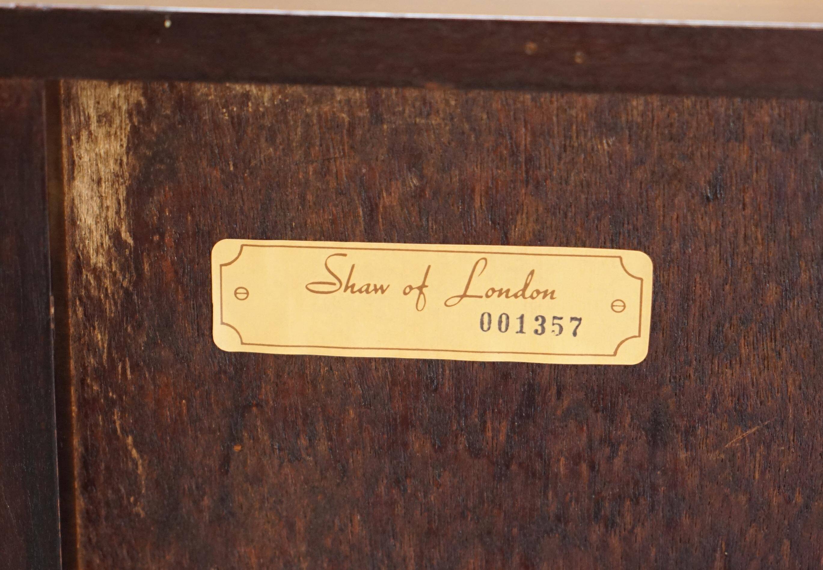 Pair of open low bookshelves Shaws of London in hardwood.
