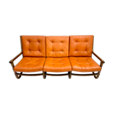 Mid-century modern rattan and cognac leather sofa