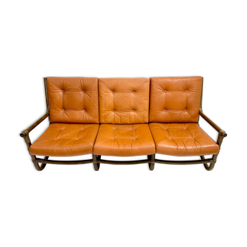 Mid-century modern rattan and cognac leather sofa