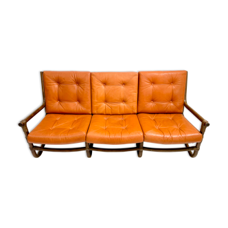 Mid-century modern rattan and cognac leather sofa