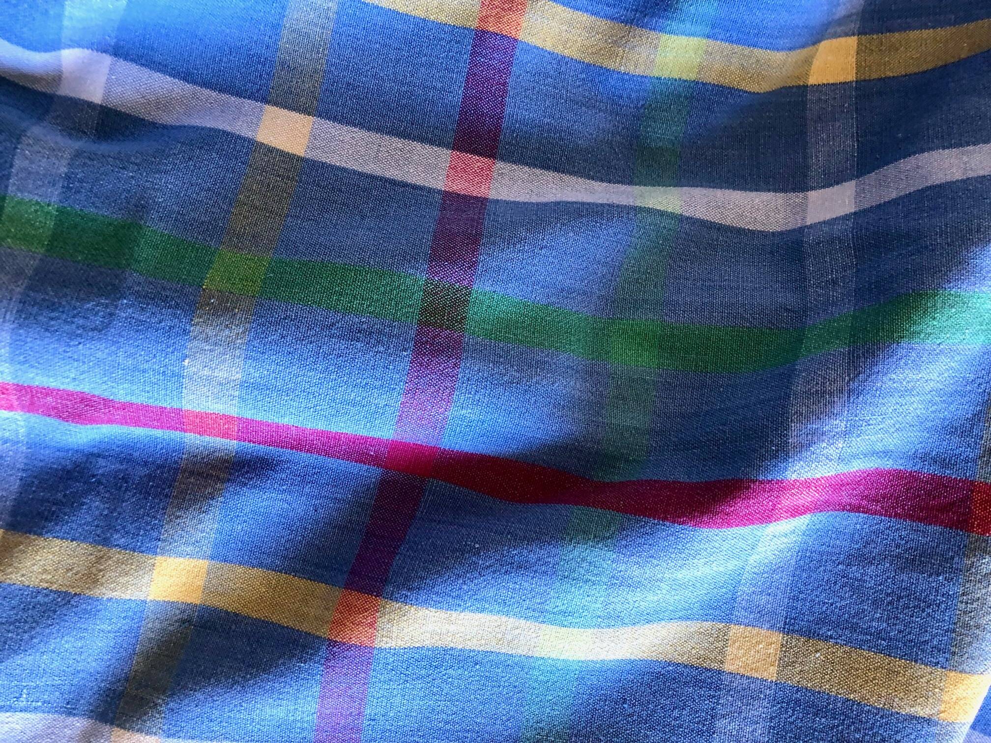 Vintage tablecloth & napkins, blue with multicoloured stripes.