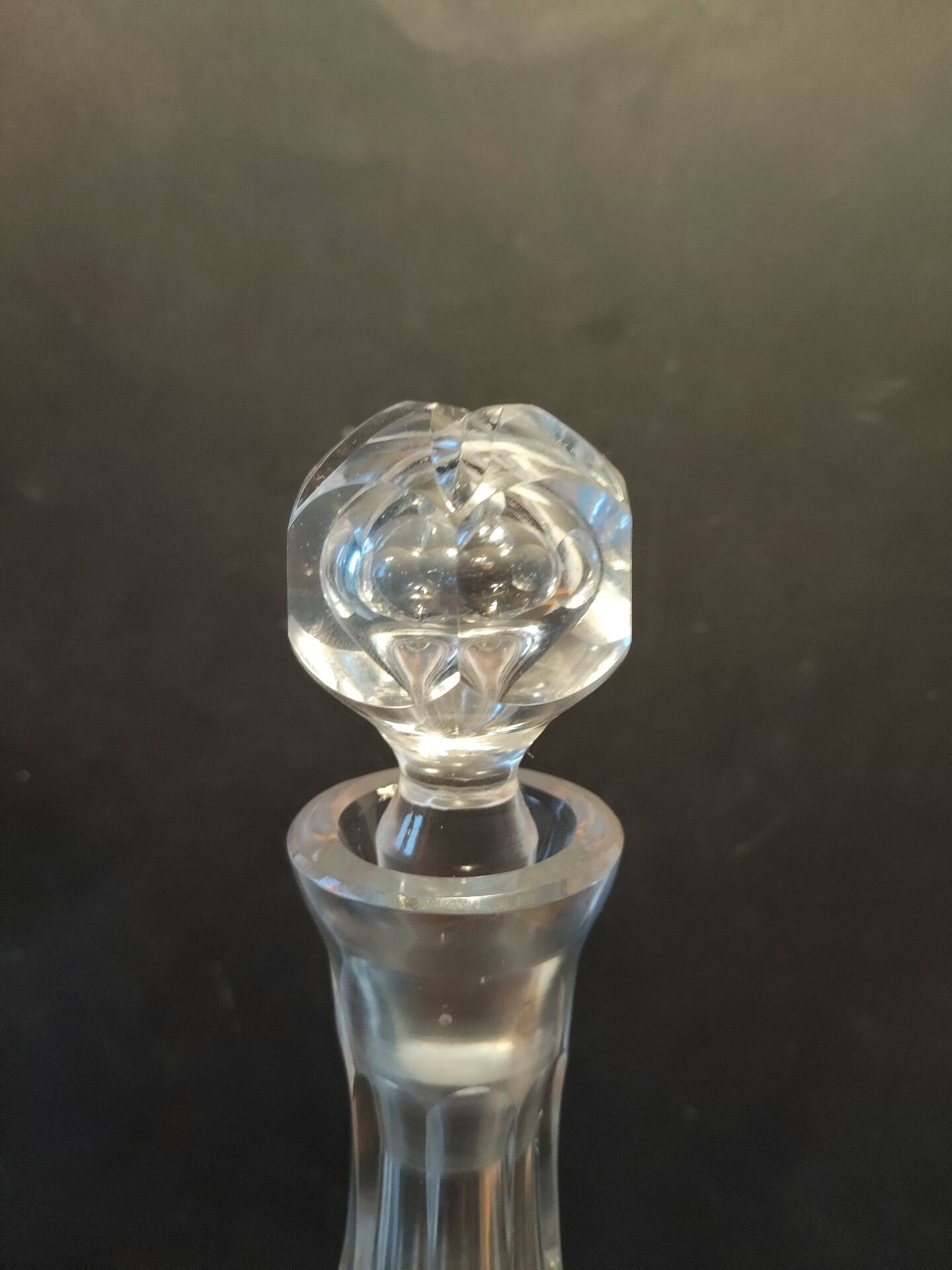 Vintage cut crystal carafe with floral stopper.