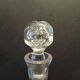 Vintage cut crystal carafe with floral stopper.