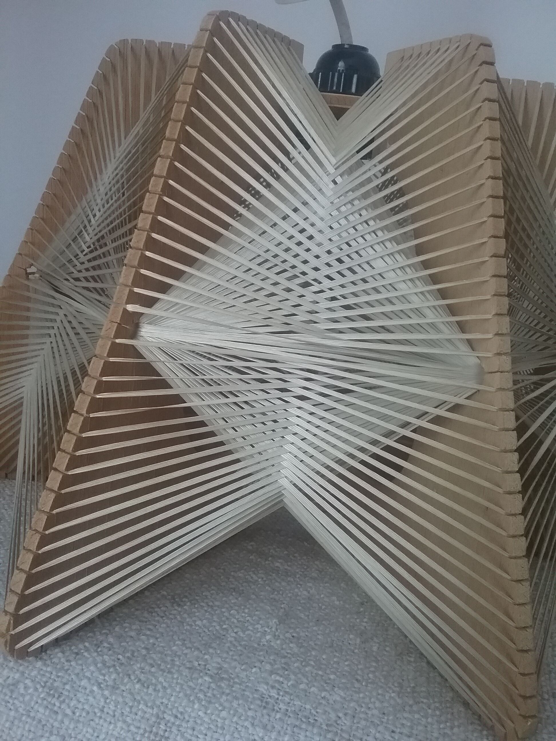 Hanging lamp of wood and thread Scandinavian style