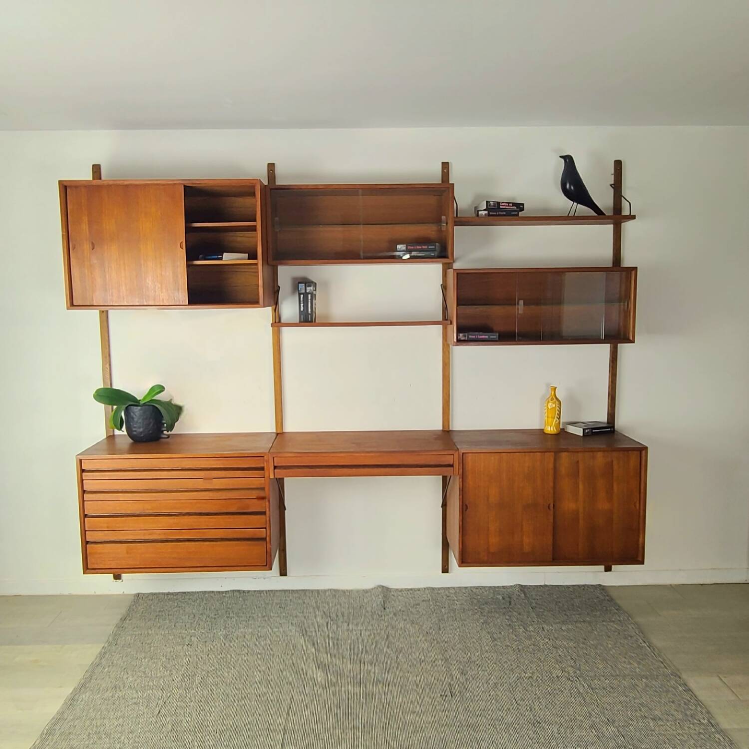 Danish wall-mounted bookshelf designed by Poul Cadovius, Scandinavian design.