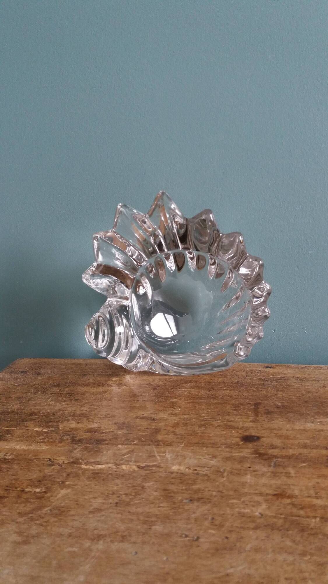 Shell-shaped crystal paperweight.