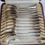Set of 12 spoons of the middle twentieth in silver metal