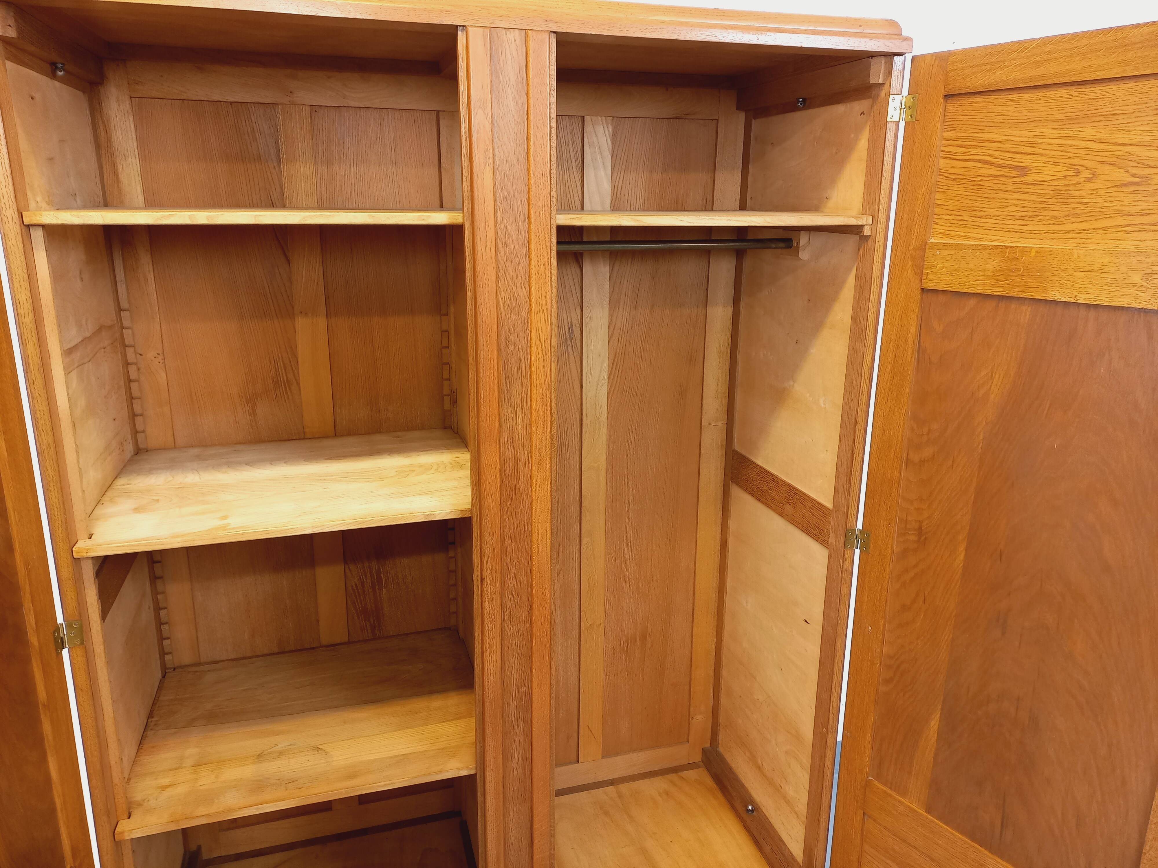 Vintage Art Deco wardrobe made of solid oak from the 1950s.