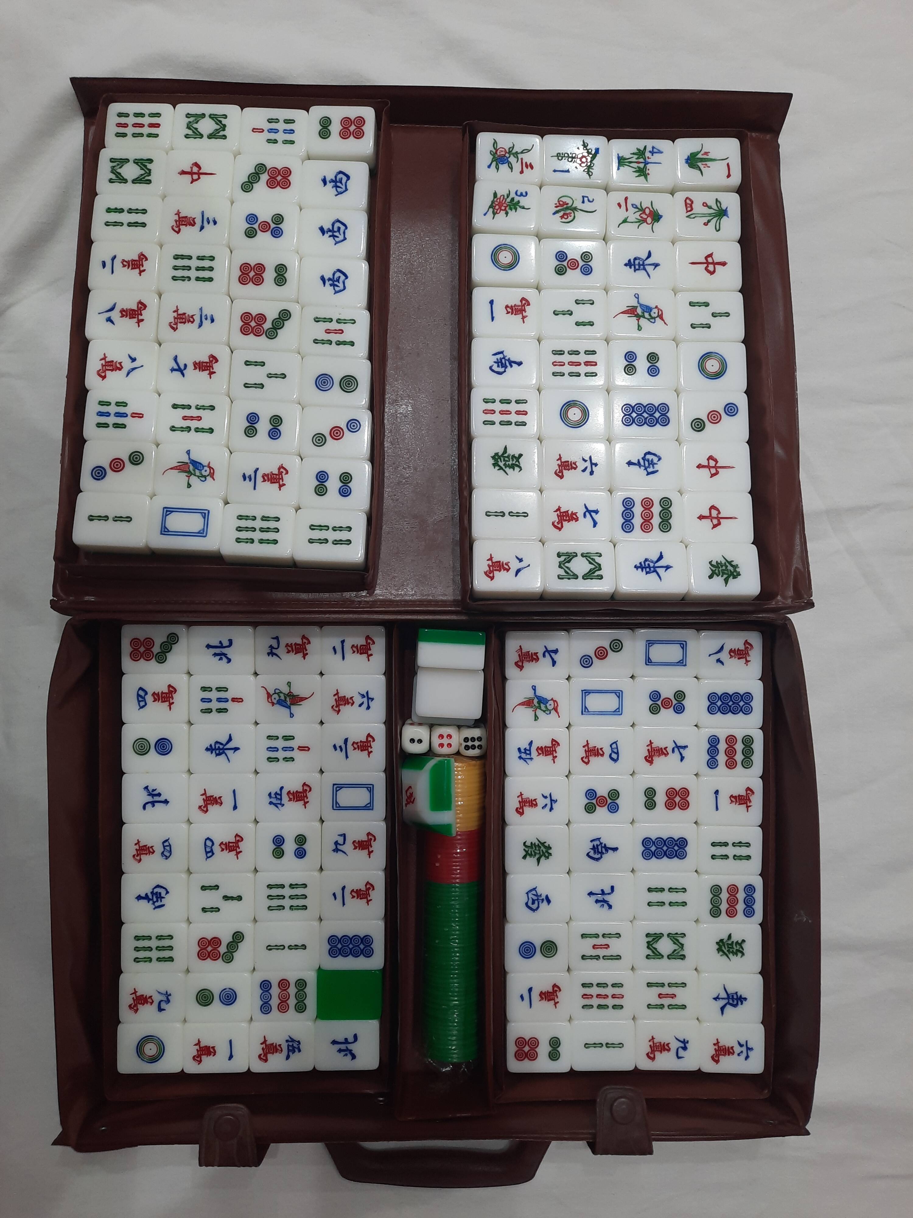 Complete vintage mahjong game with a faux leather case.