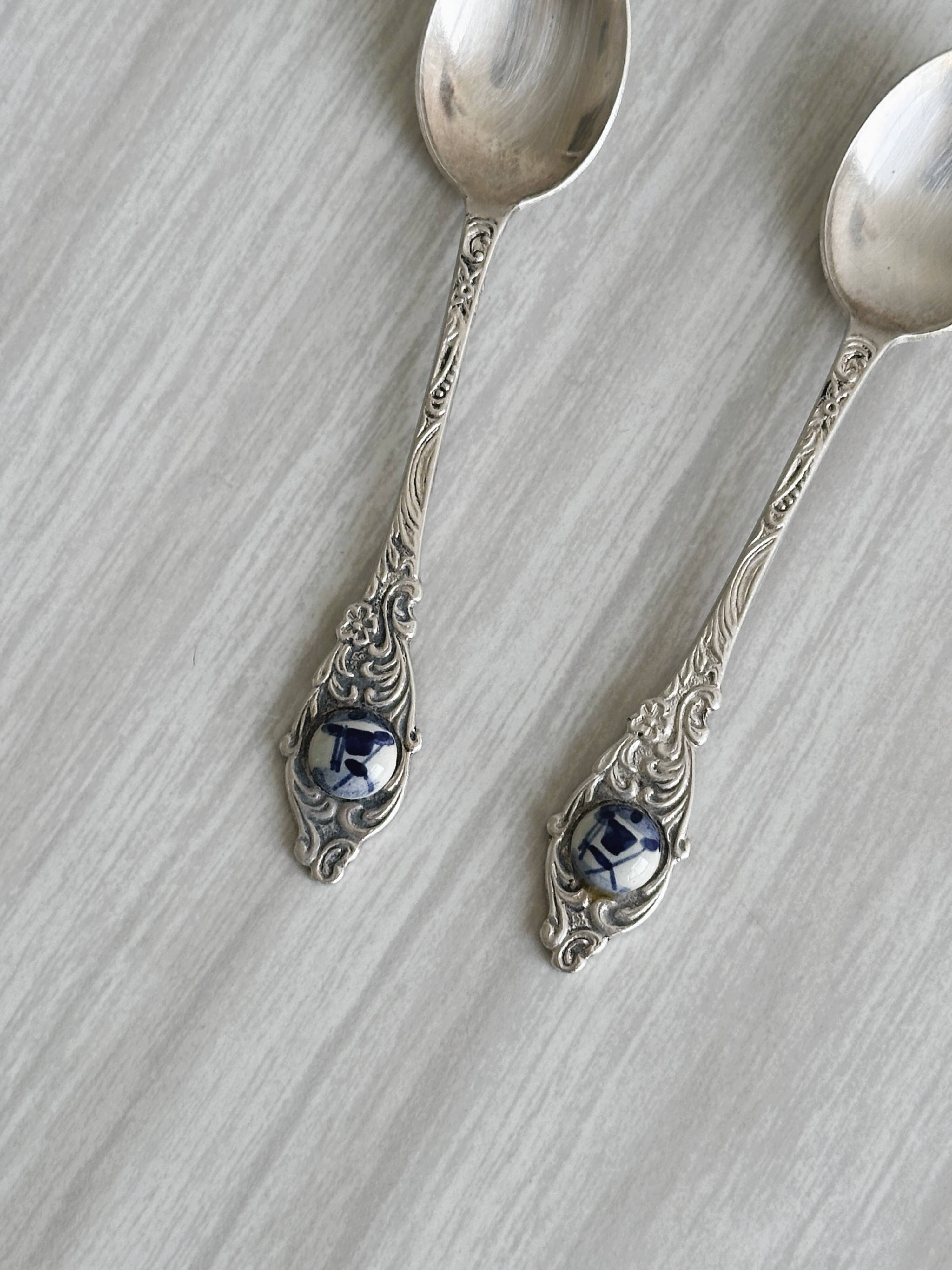 Two small metal spoons