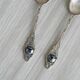 Two small metal spoons