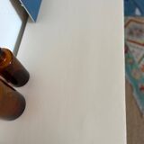 Restored wooden art deco chest of drawers with gilded handles
