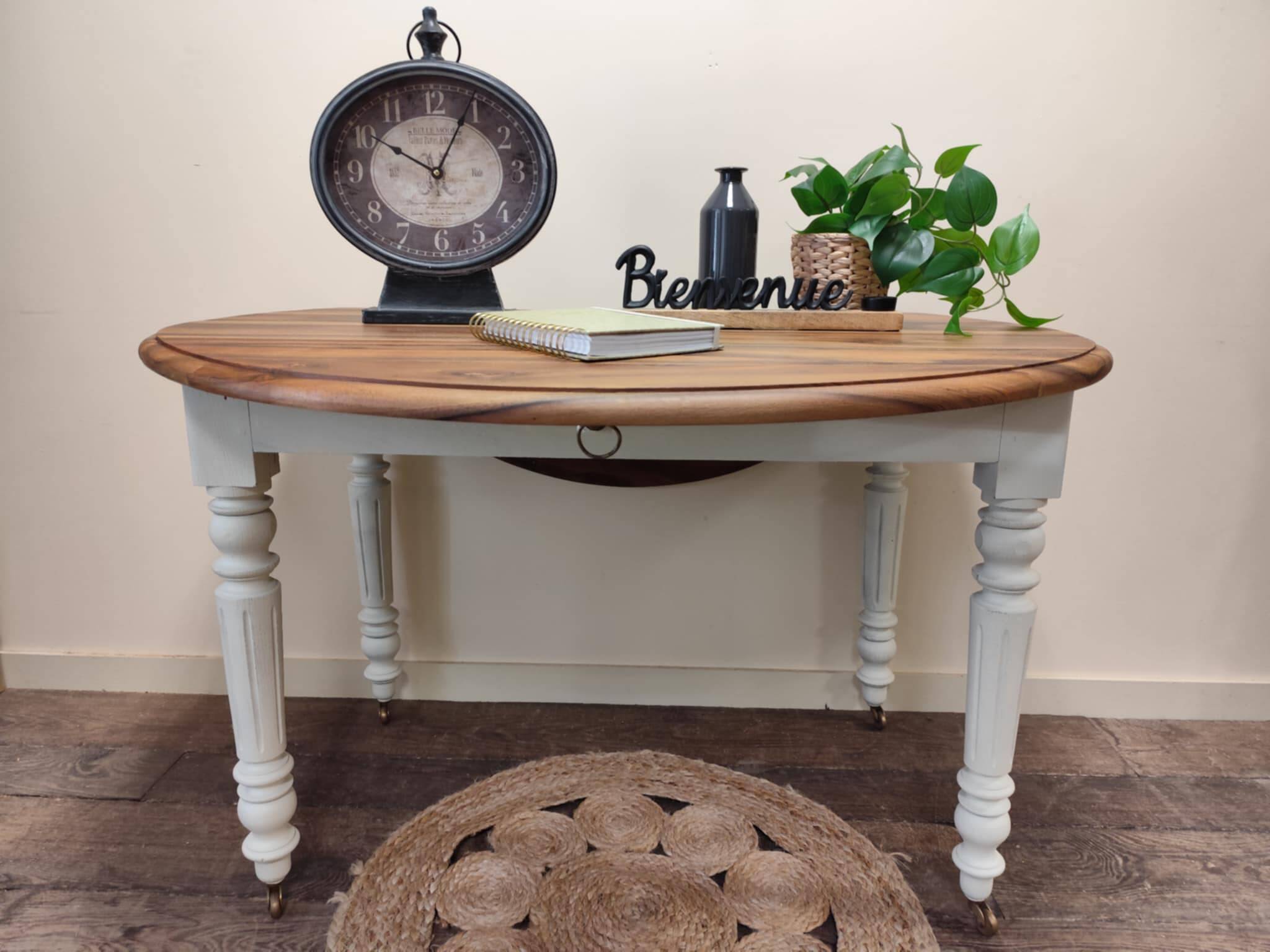 Round walnut table convertible into a console.