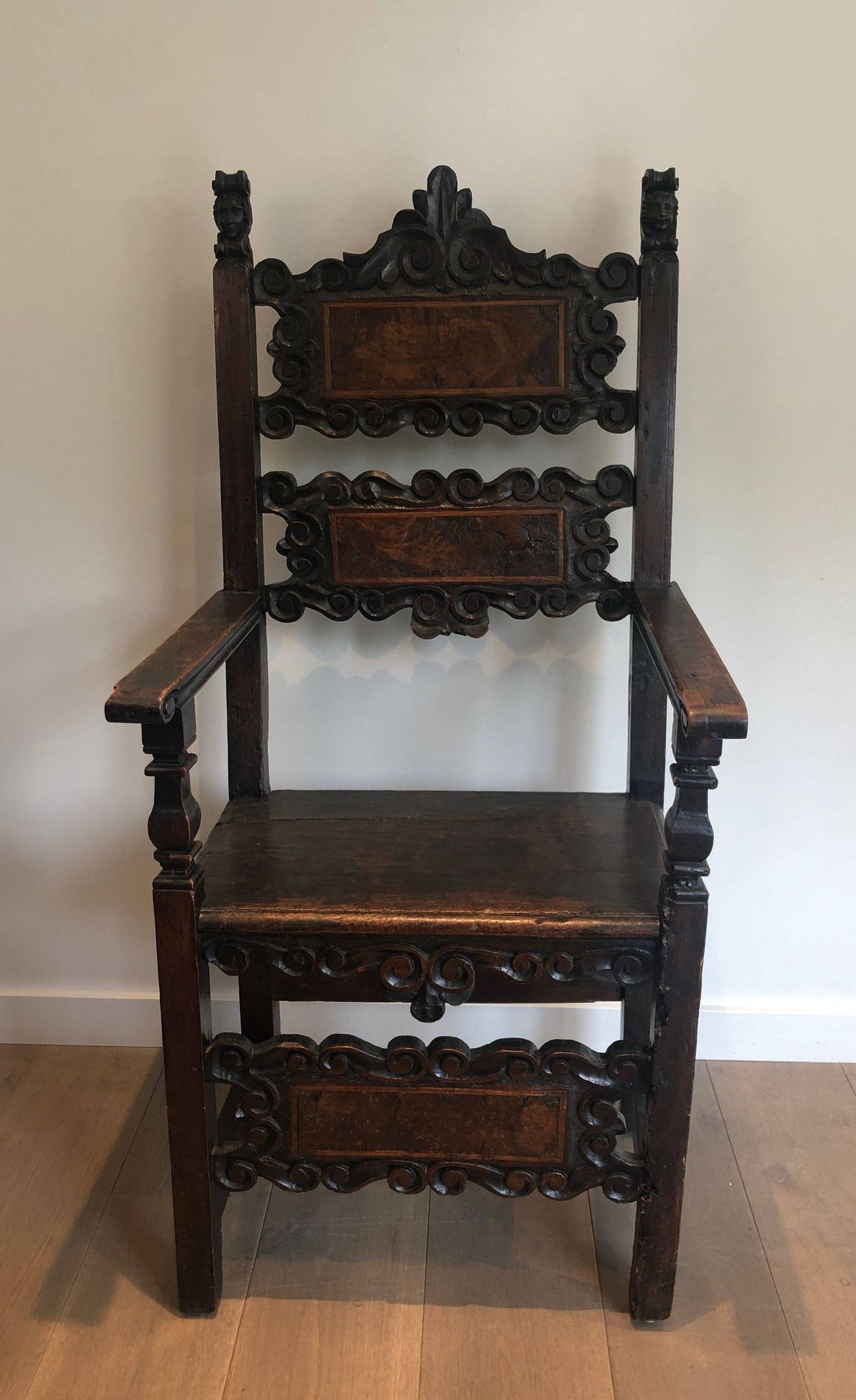 Set of an armchair and a pair of chairs in Italian Renaissance walnut
