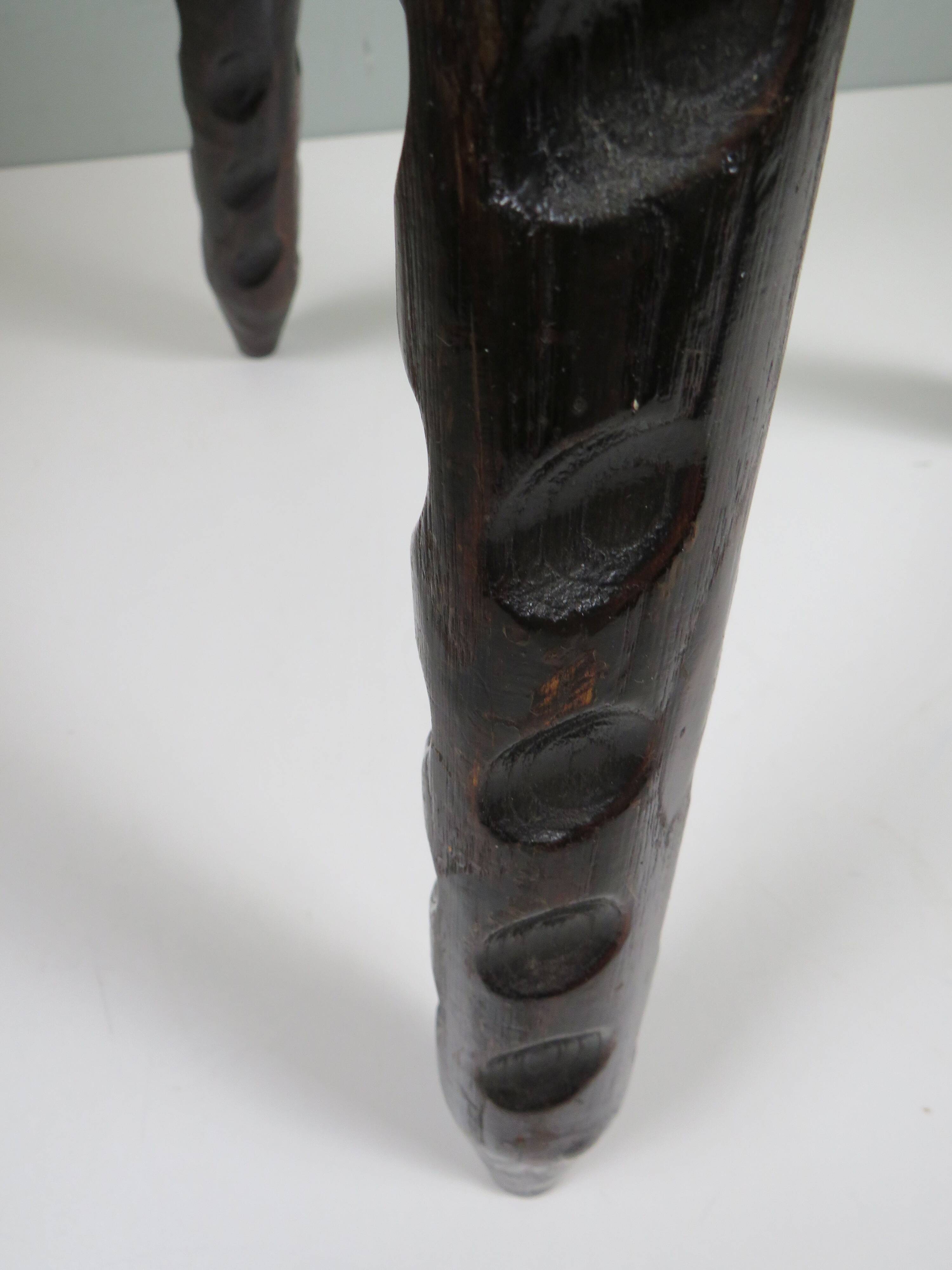 Vintage Spanish stool in carved wood with a leather seat.