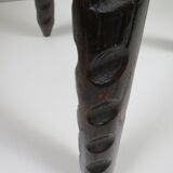 Vintage Spanish stool in carved wood with a leather seat.