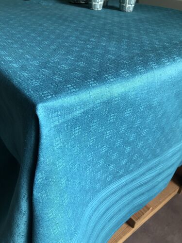 Old damask tablecloth tinted in lagoon blue