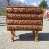Compact 4-drawer ethnic chest of drawers carved with scenes of African life