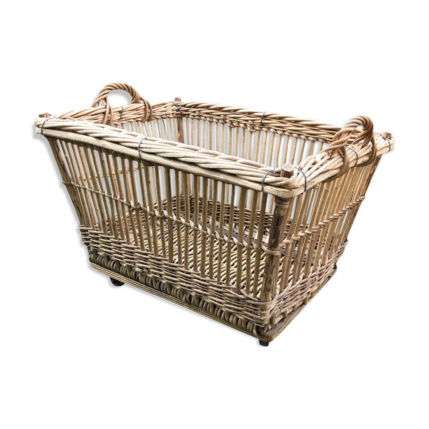 Rattan laundry basket on vintage wheels