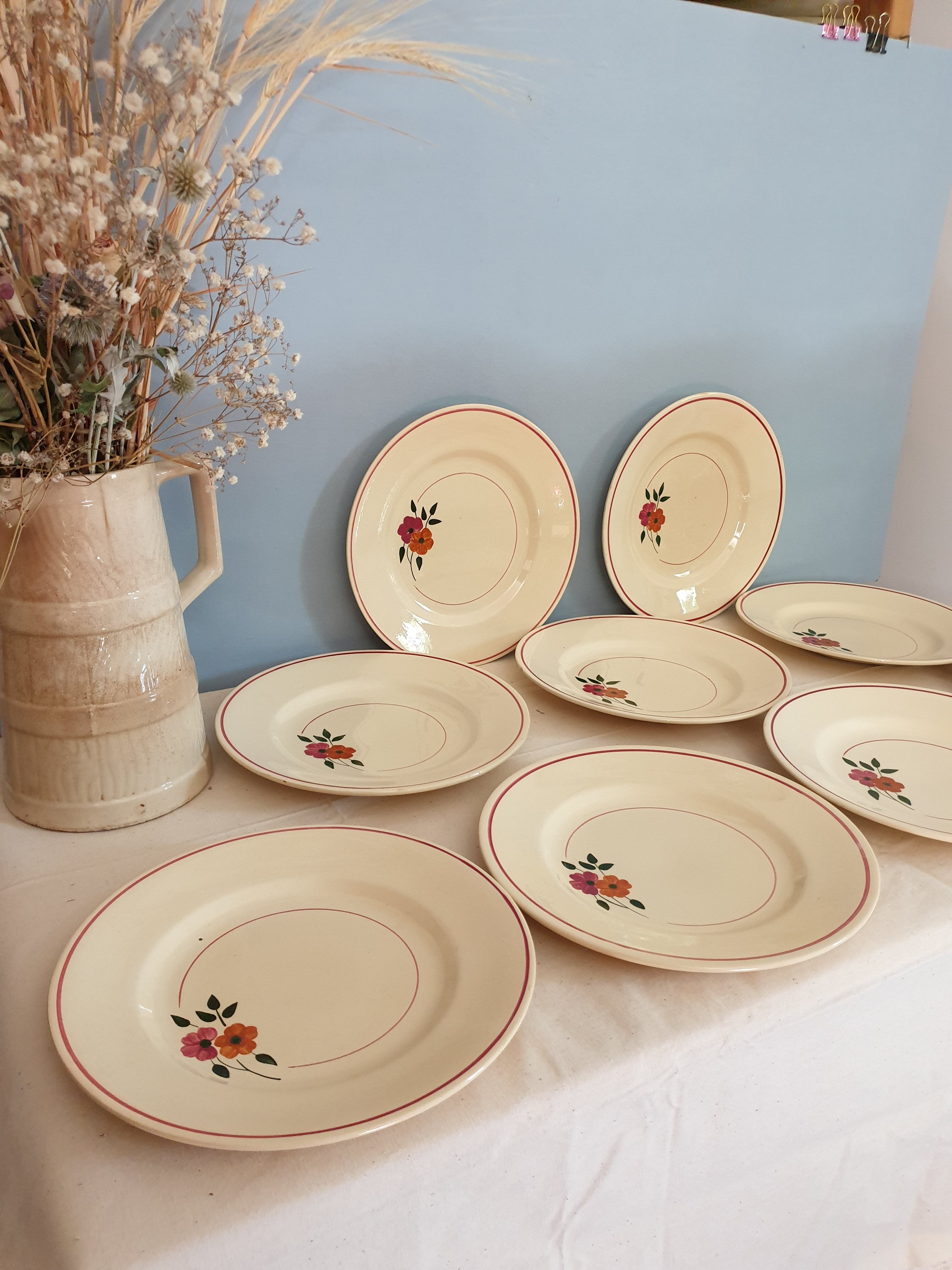 Set of 11 hand-painted earthenware plates