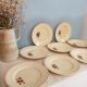 Set of 11 hand-painted earthenware plates