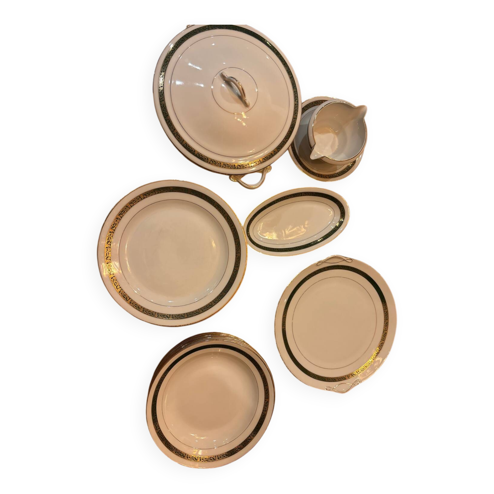 Complete old service in green and gold Limoges porcelain.