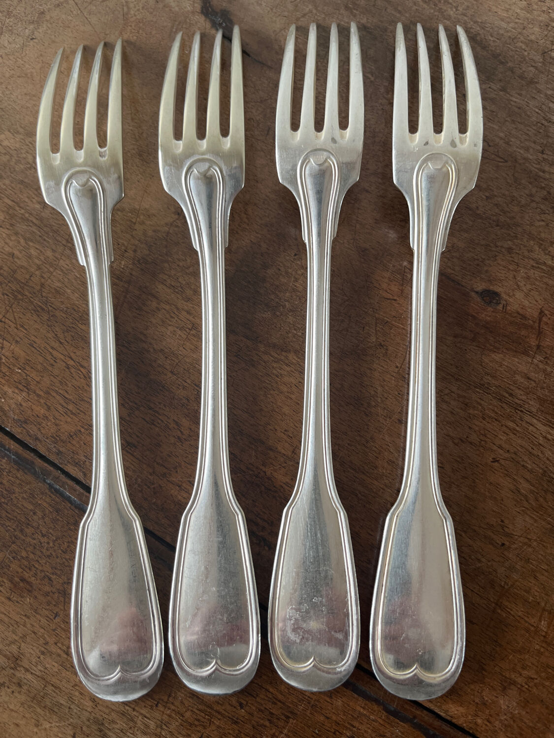 4 silver metal forks